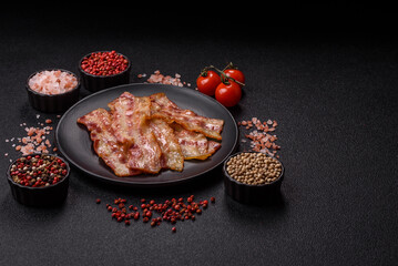 Fried smoked bacon slices, ham, jamon, or prosciutto strips for cooking. Fried bacon