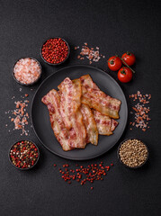Fried smoked bacon slices, ham, jamon, or prosciutto strips for cooking. Fried bacon