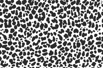 Leopard skin seamless texture with irregular black spots. Safari animal motif for fashion fabric. Abstract dotted background with organic shapes for wallpaper and textile. Vector