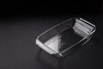 A rectangular transparent glass tray for baking and cooking at home. The glass tray
