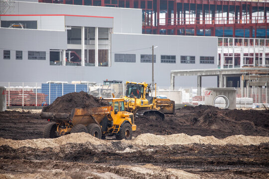 Crawler dozer, backhoe loader, articulated dump trucks and excavator on a construction site. Construction equipment. Heavy machines. Construction site.