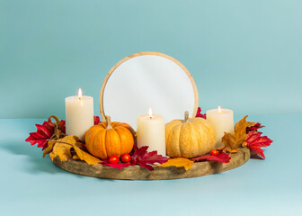 a mirror and candles on a table
