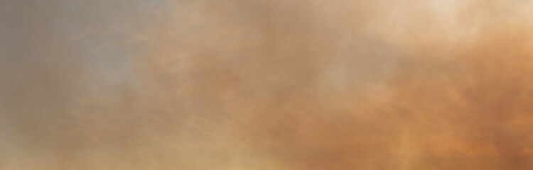 The sky is smoke-filled from spring fires of dead wood and fields, backlit by the sun, and there is a danger of forest fires near the city.