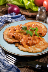 Homemade potato pancakes with goulash.