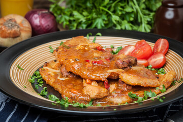 Potato pancakes with meat, vegetable, tomato and parsley.