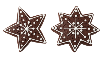 Two dark brown gingerbread star cookies, detailed with intricate white icing patterns, isolated on a transparent background PNG (तारा कुकी)