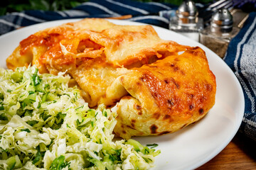 Stuffed pancake baked with cheese.