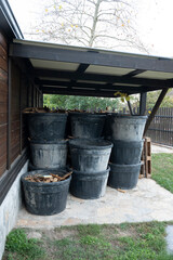 Obraz premium Firewood Stored in Plastic Pots Outdoors