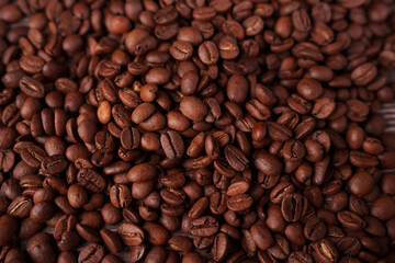 close-up view of a rich, textured array of roasted coffee beans displaying a warm, earthy palette and intricate details in a cozy and inviting atmosphere, energizing, darkbrown, shiny, colorful