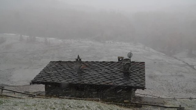 Traditional Stone Alpine Ht in a Heavy Snowstorm