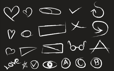 Collection of hand drawn symbols and shapes on blackboard