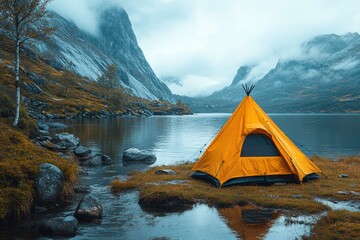 Wild camping with lightweight gear by a lake in the mountains during cloudy weather