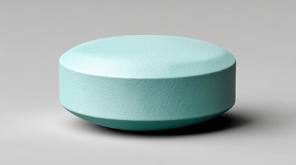 Round object in light blue color on a gray surface during daylight