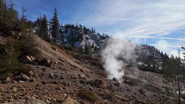 This scenic view captures the steam vents and boiling mud pots of the Sulphur Works hydrothermal area at Lassen Volcanic National Park
