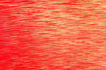 Abstract blurred background in shades of red and orange. Ideal for holiday themes, winter celebrations, Christmas, and New Year.