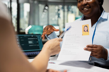 Human resources specialists applying artificial intelligence systems and smart automation to filter...