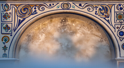 a close-up of an archway with intricate blue and orange designs on the top and bottom. The archway appears to be made of stone or stone and is decorated with a floral pattern