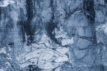 High resolution close-up of natural blue toned marble stone surface with veins and cracks, suitable as abstract background