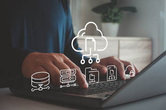Businessman using laptop with cloud computing diagram, data storage and network connection concept for business technology solutions and security. digital storage, security infrastructure management. - Powered by Adobe