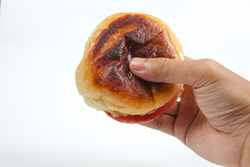 hand holding hamburger isolated on white background