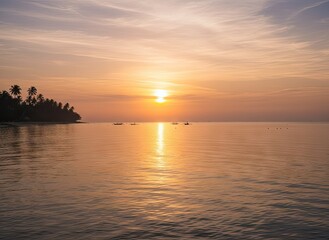 Obraz premium Golden Sunset Over Calm Ocean With Palm Trees Silhouetted Against Orange Sky And Rippling Water Reflections