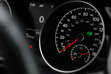 View of speedometer with fuel level in modern car, closeup
