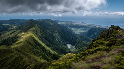 A mountain range with a lake in the middle. The sky is cloudy and the mountains are covered in green trees