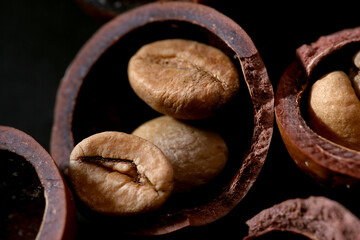 Close up of ground coffee beans in the macadamia shell