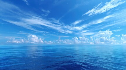 Obraz premium A clear blue sky with a few clouds. The sky is very bright and the clouds are scattered throughout. The water is calm and still, reflecting the blue sky above. The scene is peaceful and serene