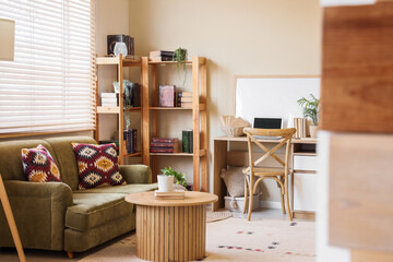 Table, workplace and bookcases in room © Pixel-Shot