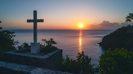 A white cross is on a stone wall overlooking the ocean