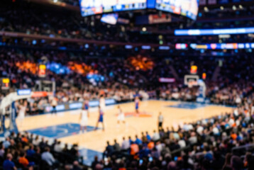 Obraz premium Blurred basketball game in arena with spectators