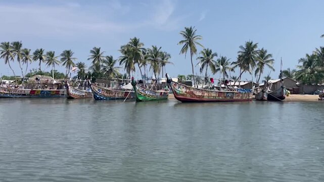 A tropical beach with boats, Ada Ghana
