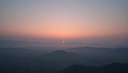 Pastel sky fading softly into a hazy horizon at dawn