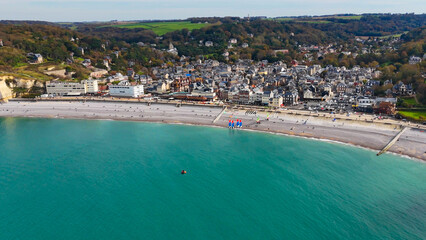 Aerial drone view of picturesque coastal limestone cliffs and the English Channel town of Etretat, France