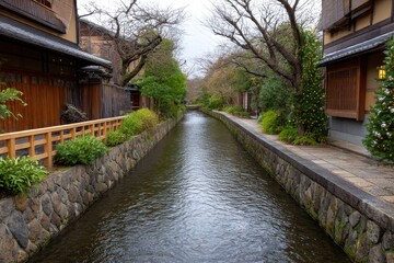 A narrow canal lined with stone walls flows between buildings and trees hinting at a serene possibly urban landscape
