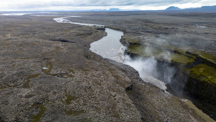 Aerial view of powerful Water Flowing On Detifoss Waterfall In Vatnajokull National Park In Iceland.