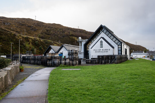 TARBERT, ISLE OF HARRIS, SCOTLAND &ndash; OCT 10, 2025: Isle of Harris Distillery, makers of Single Malt Whisky, The Hearach, wood oak barrels out front
