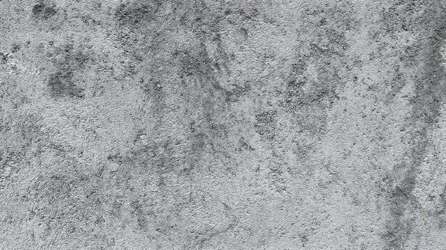 Texture concrete wall of light grey color cement texture background.Grey pastel rough crack cement texture stone concrete,rock plastered stucco wall; painted flat fade background. Side view.