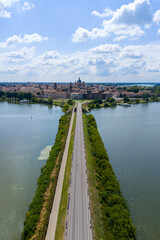 Fototapeta premium Skyline of Mantua across Lago Superiore causeway - Mantua, Italy