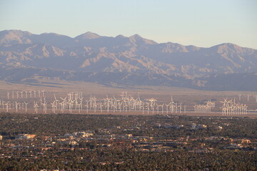 Fototapeta premium Windmills of Coachella Valley and the Peninsular range mountains at sunrise from Palm Springs, California