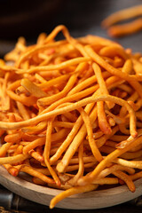 closeup of cordyceps mushrooms on table.