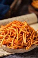 Golden cordyceps mushrooms on wooden table.