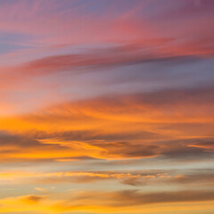 Fototapeta premium Vibrant sunset sky with colorful clouds