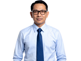 Handsome young businessman in suit and tie smiling confidently