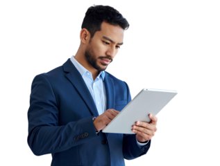 Smiling businessman in a suit holding a tablet and laptop while standing in a modern office workspace