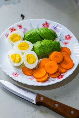 Breakfast with boiled eggs with avacado and carrot 