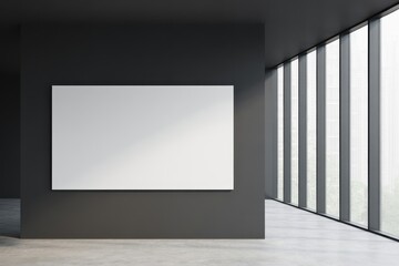 Blank white poster on gray wall in office interior with big window