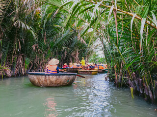 Tourists riding bamboo basket boats in Hoi An, vietnam (Cam Thanh water coconut village )