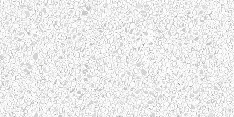 Fototapeta premium A full frame view of small white and gray pebbles covering the surface